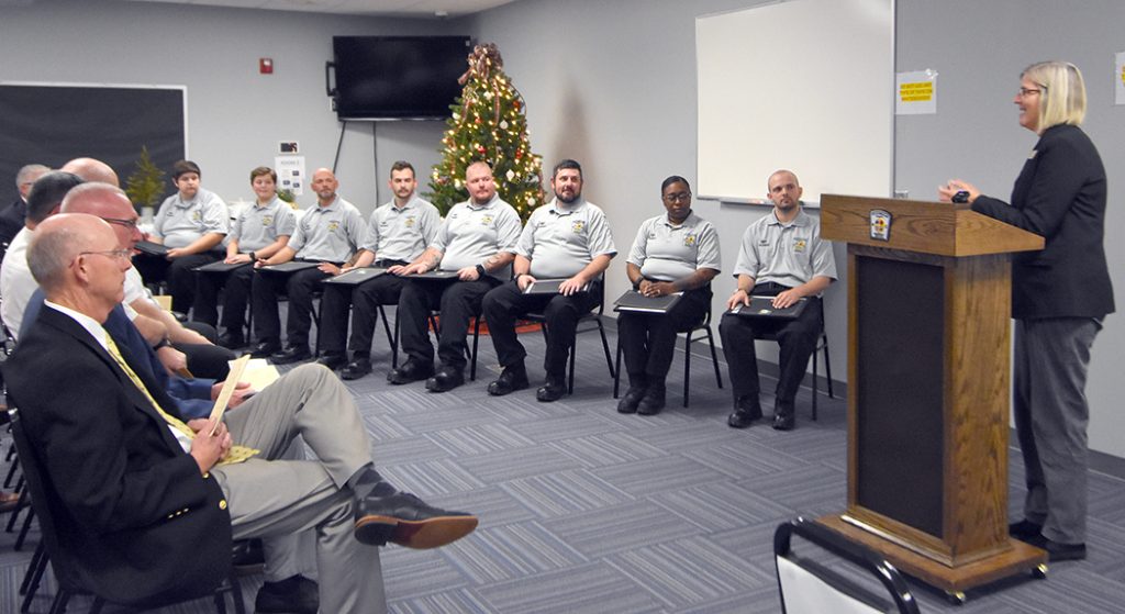 EMT graduates listen to Dean Vickie Chitwood speak.