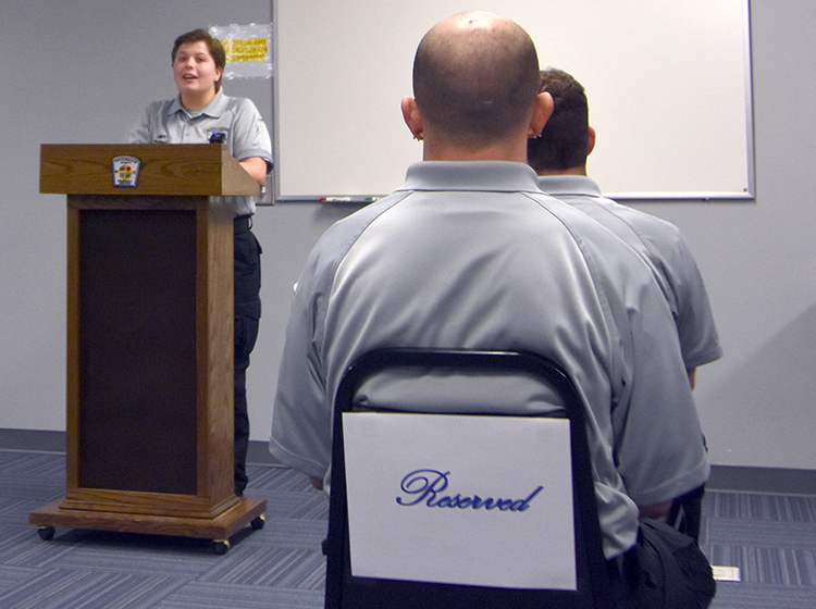 EMT graduate Ceadez Caulder speaks during the EMT Academy commencement ceremony.