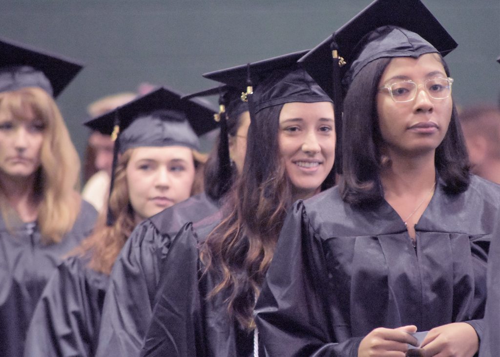 May 2023 RCC graduates proceed into the gymnasium.