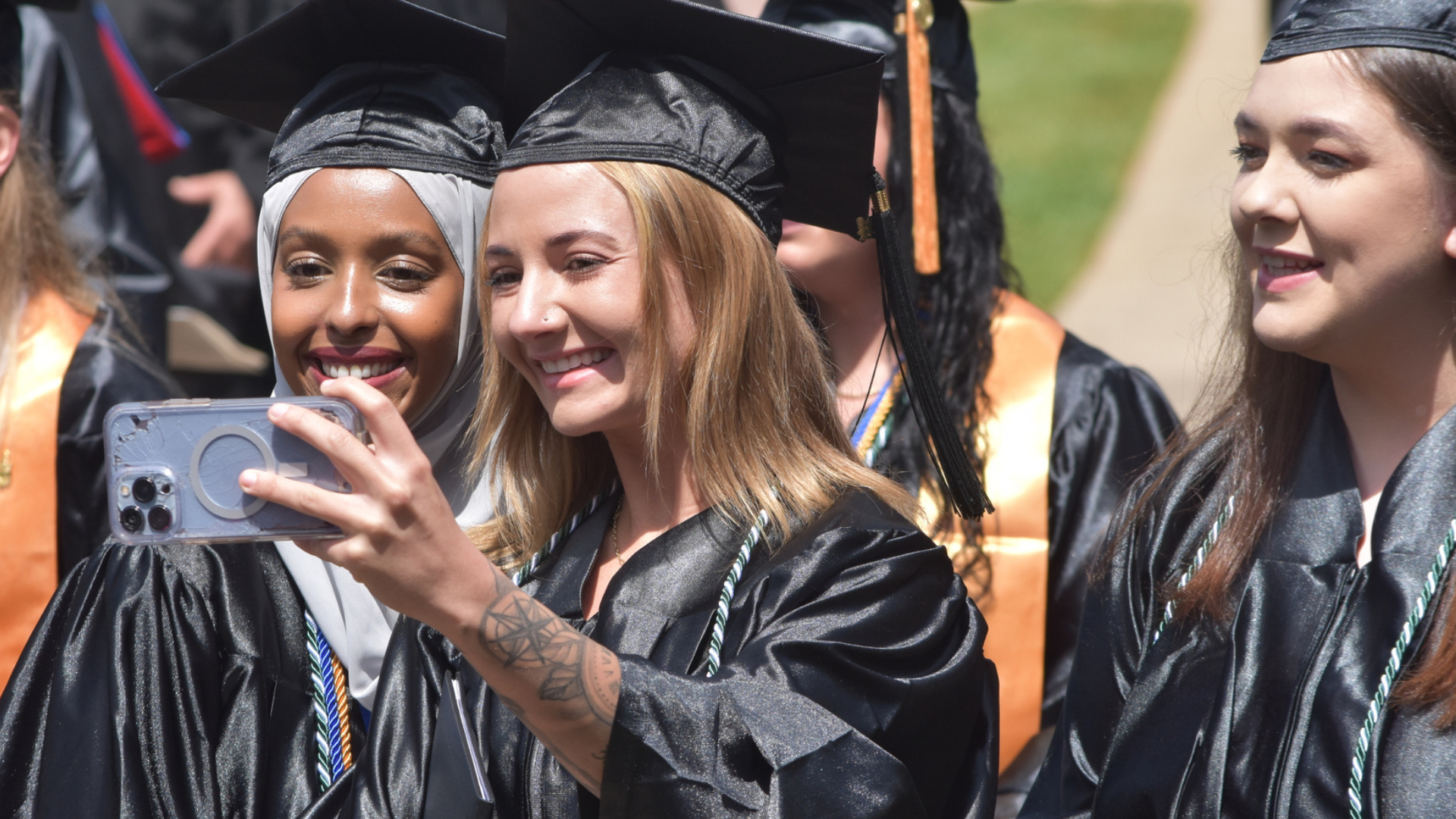 Two female graduates take a selfie