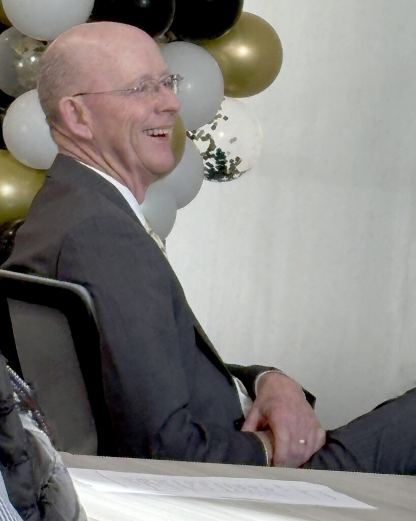 Man sitting a chair smiling