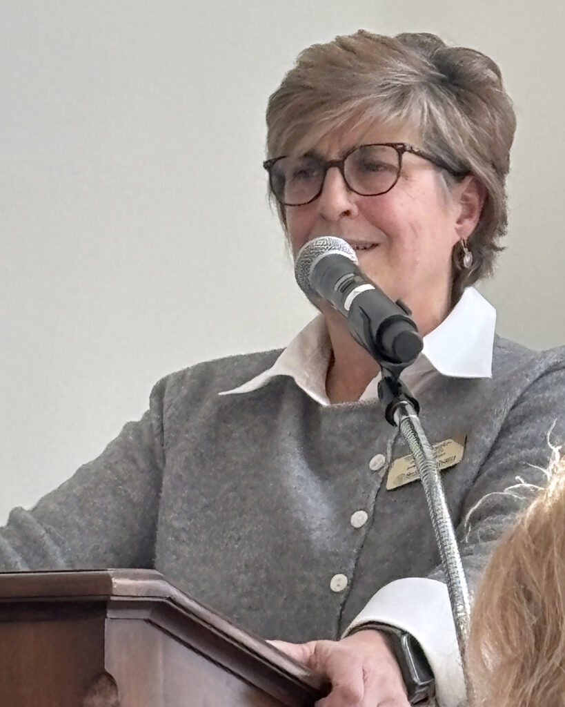 Woman speaks at podium