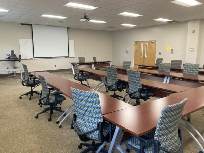 Picture of ADT 105. Tables and chairs in a U shaped pattern.