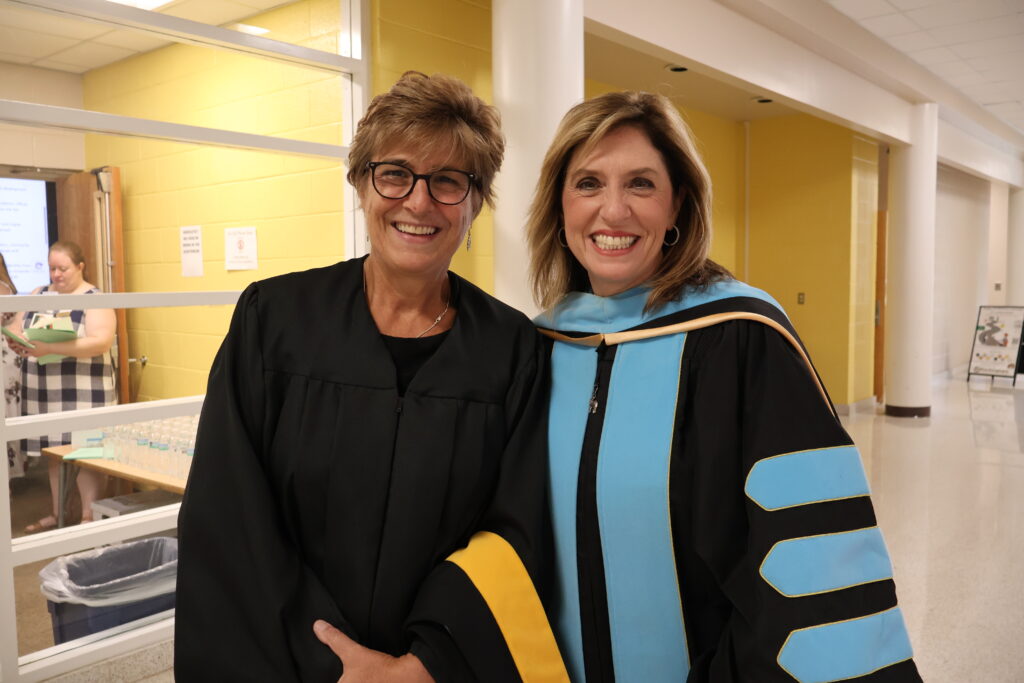 Two women grin