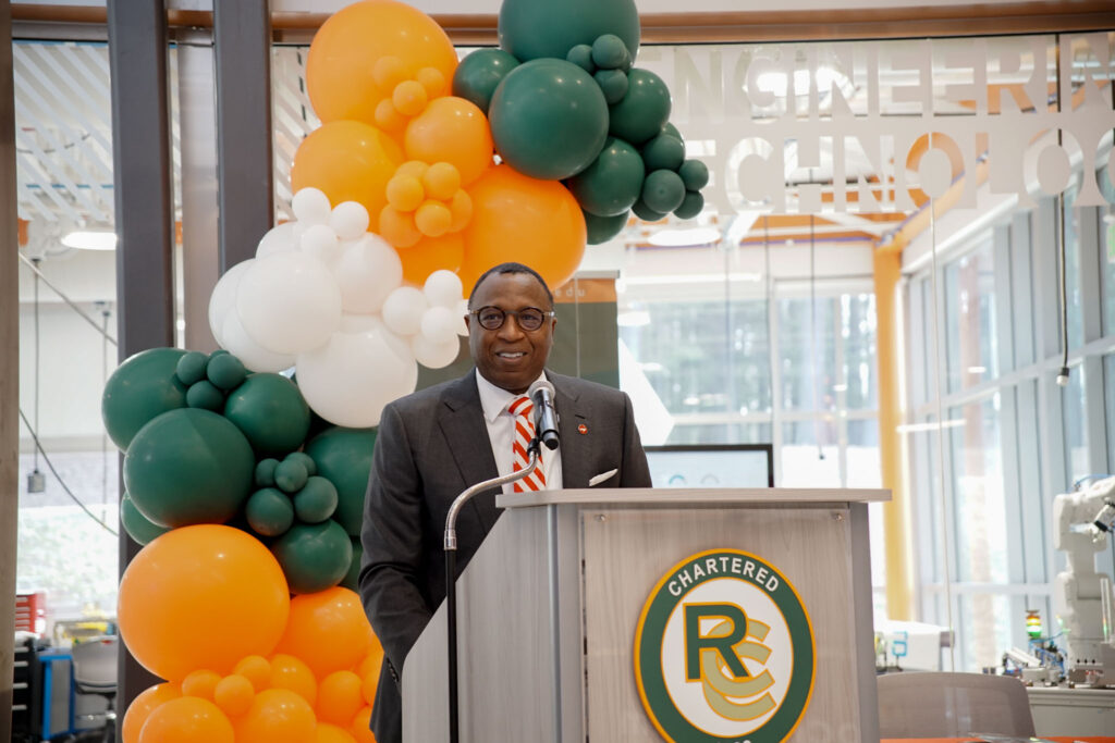 A man speaks at a podium