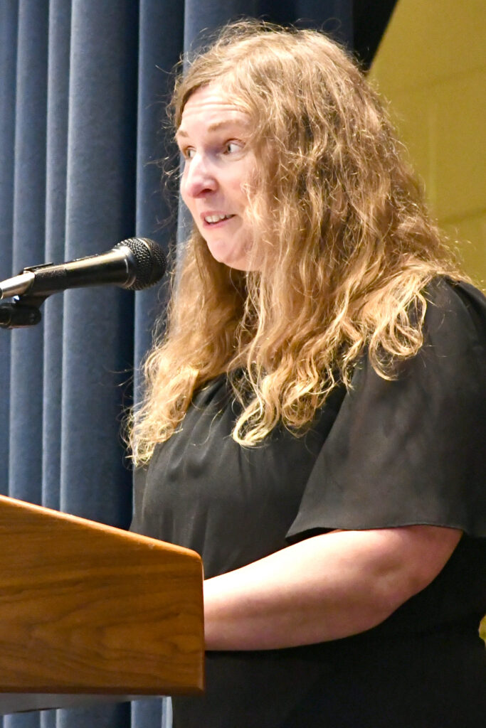Club Advisor Dr. Alana Baker speaks during the PTK induction ceremony.