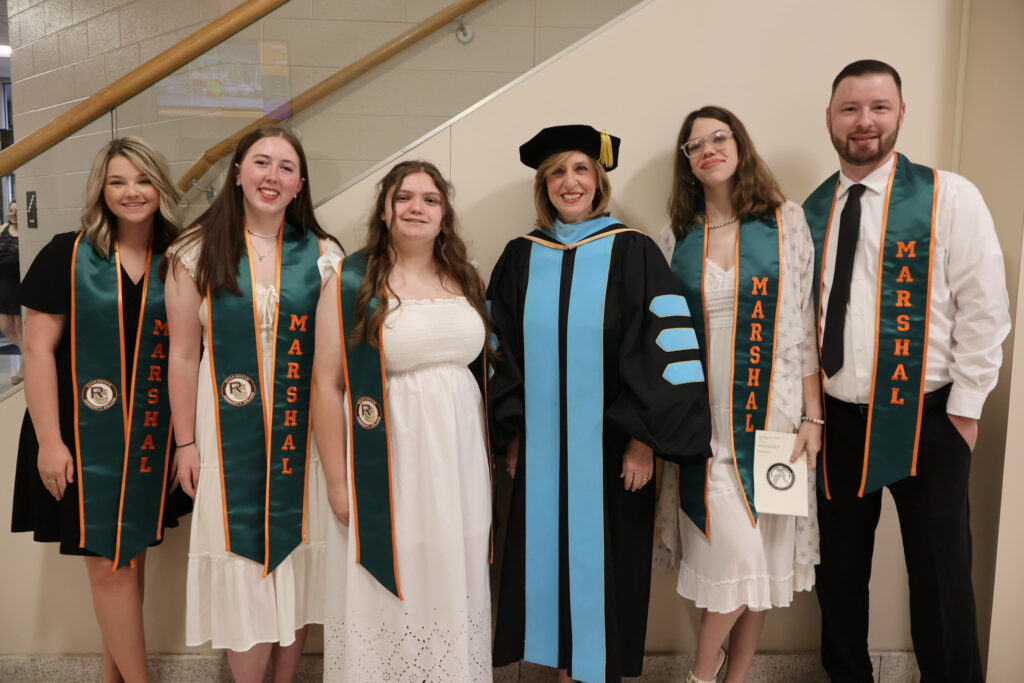 Student marshals and college president, before the graduation ceremony.