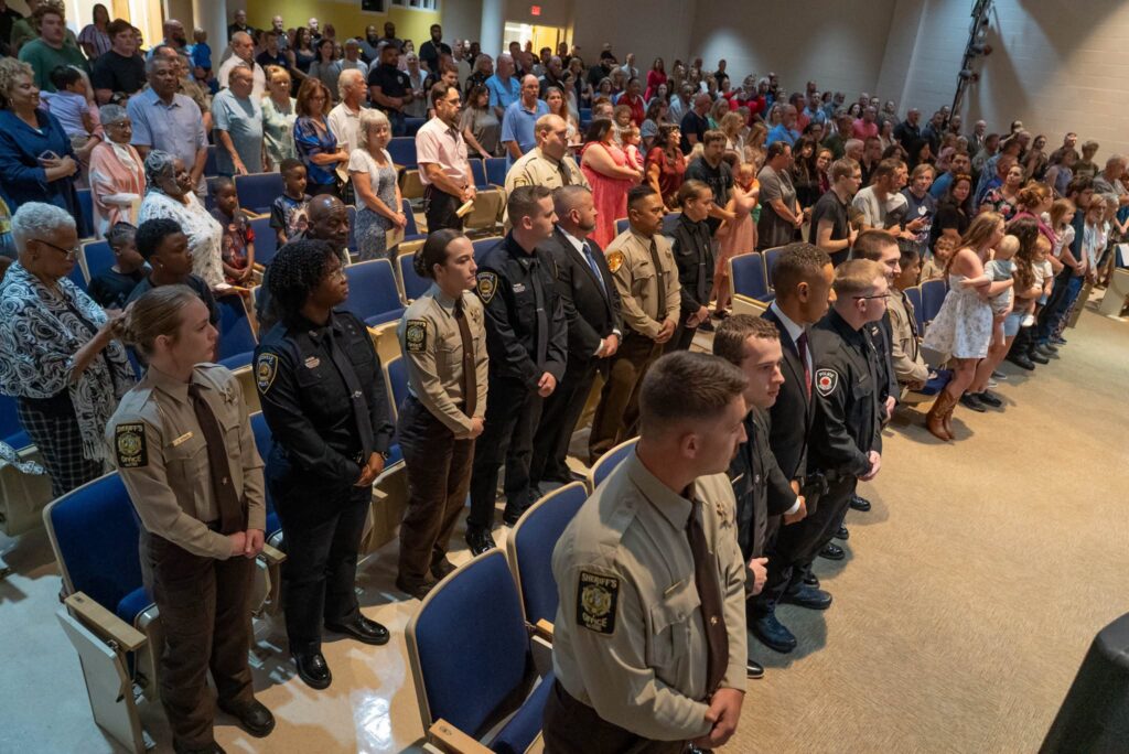 Audience of law enforcement officers, friends and family.