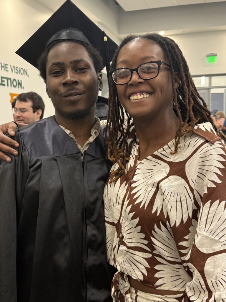 CCR Graduation standing with a family member.