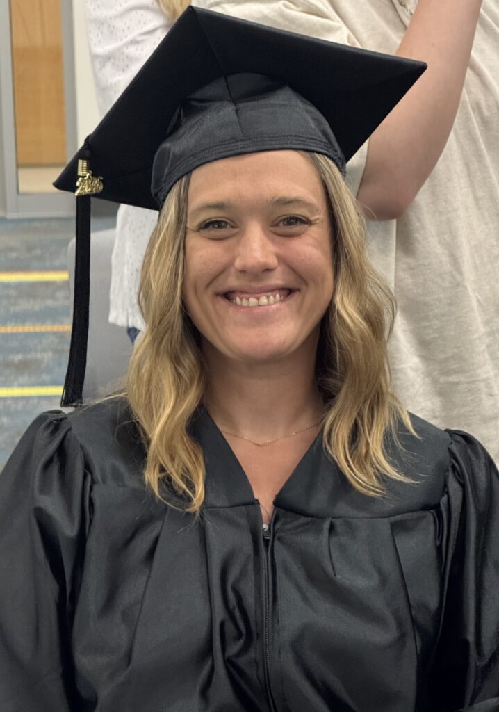 CCR graduation smiling for a picture at the graduation ceremony.